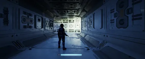 A secret screenshot of our upcoming game, with a character silhouetted against a blue and yellow sci-fi hallway.